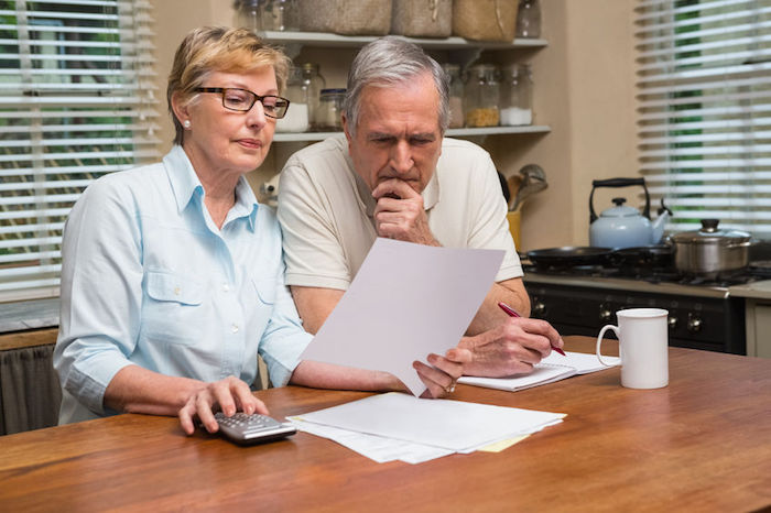 Senior couple reviewing finances.