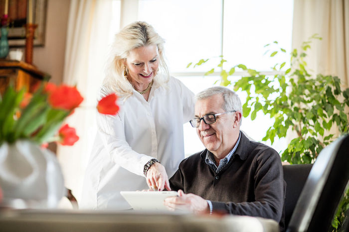 Elderly couple reviewing finances